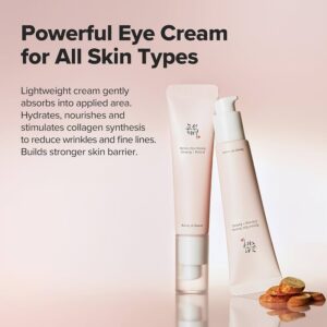 To lyserøde tuber med Beauty Of Joseon - Revive Eye Serum : Ginseng + Retinal står oprejst på en beige overflade med nødder og tørrede skiver i nærheden. Dette lette, fugtgivende serum hjælper med at reducere rynker og styrker hudbarrieren for alle hudtyper.