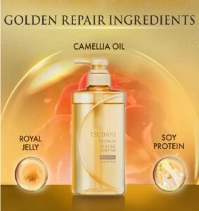 En gylden flaske med Shiseido - Tsubaki Premium Volume & Repair Shampoo står i centrum og fremhæver Camellia Oil, Royal Jelly og Soy Protein mod en strålende gylden baggrund.