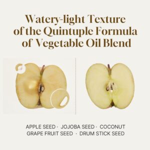To halverede æbler på creme fremhæver den lette, vandige olietekstur i HEVEBLUE - Salmon Caring Centella Light Cleansing Oil, der indeholder en nærende blanding af æblekerne-, jojobafrø-, kokos-, grapefrugtkerne- og drumstick-frøolie.